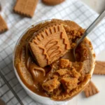 Lotus Biscoff mug cake topped with cookie butter and crumbs